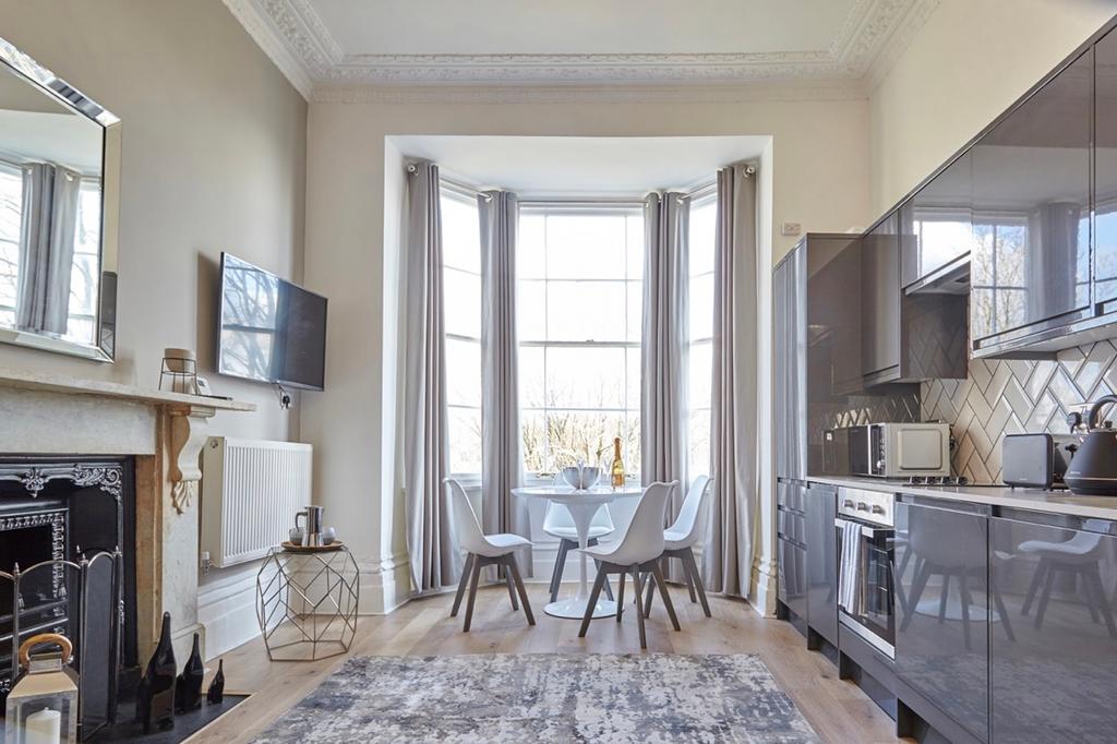 A modern and clean kitchen with a dining area f...