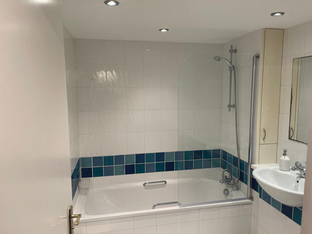 A bright and clean bathroom featuring a modern ...