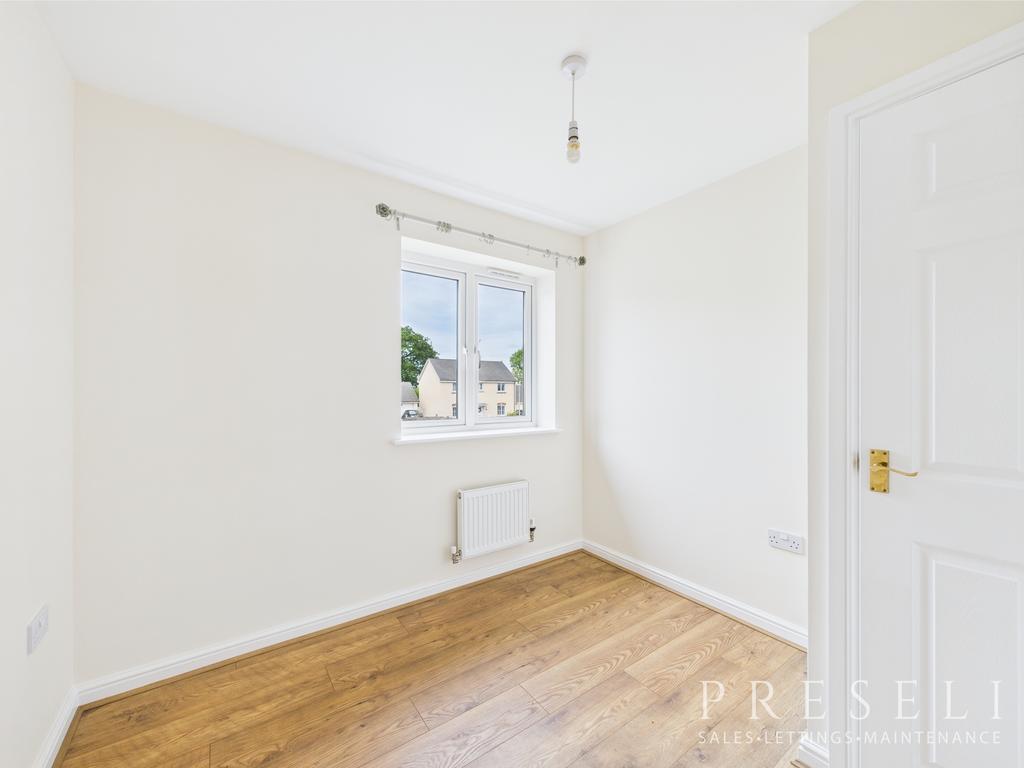 Smaller rear bedroom