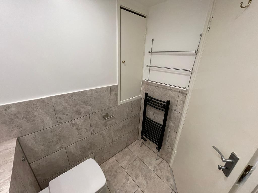 A clean and well-maintained single toilet room ...