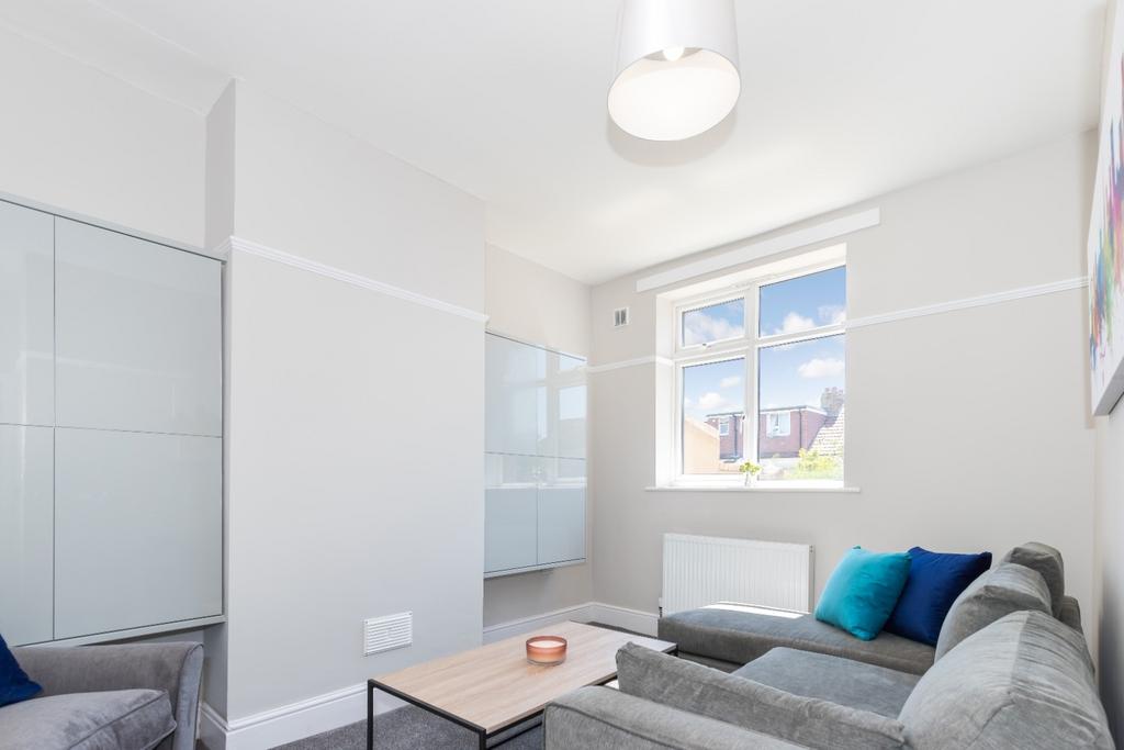 A bright and inviting living room featuring mod...