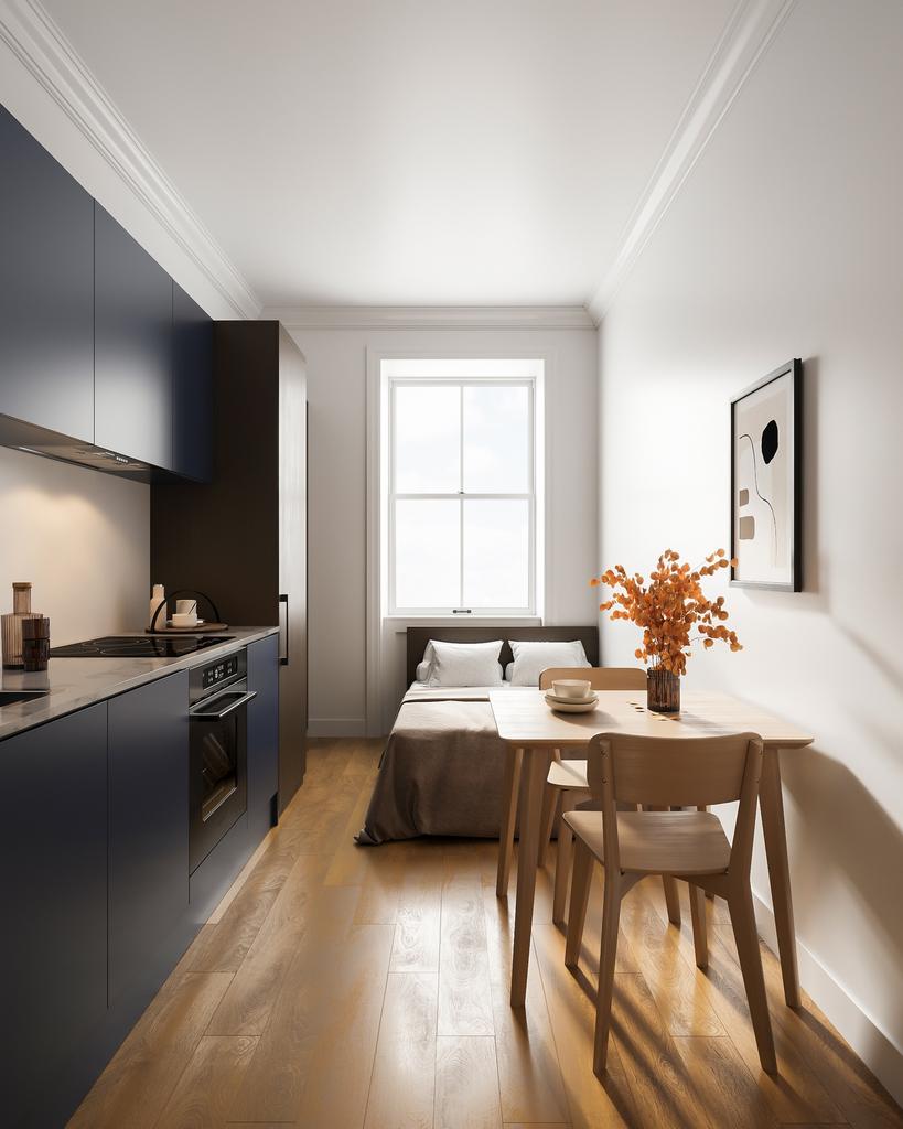 A modern kitchen with a small dining area, feat...