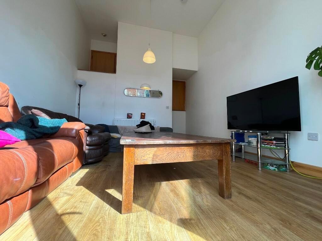 Bright and welcoming living room featuring a sp...