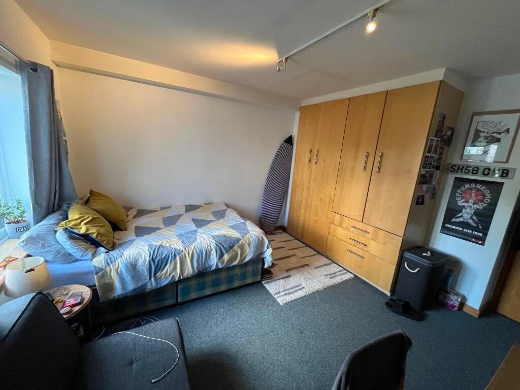 Bright and cozy double bedroom featuring a comf...