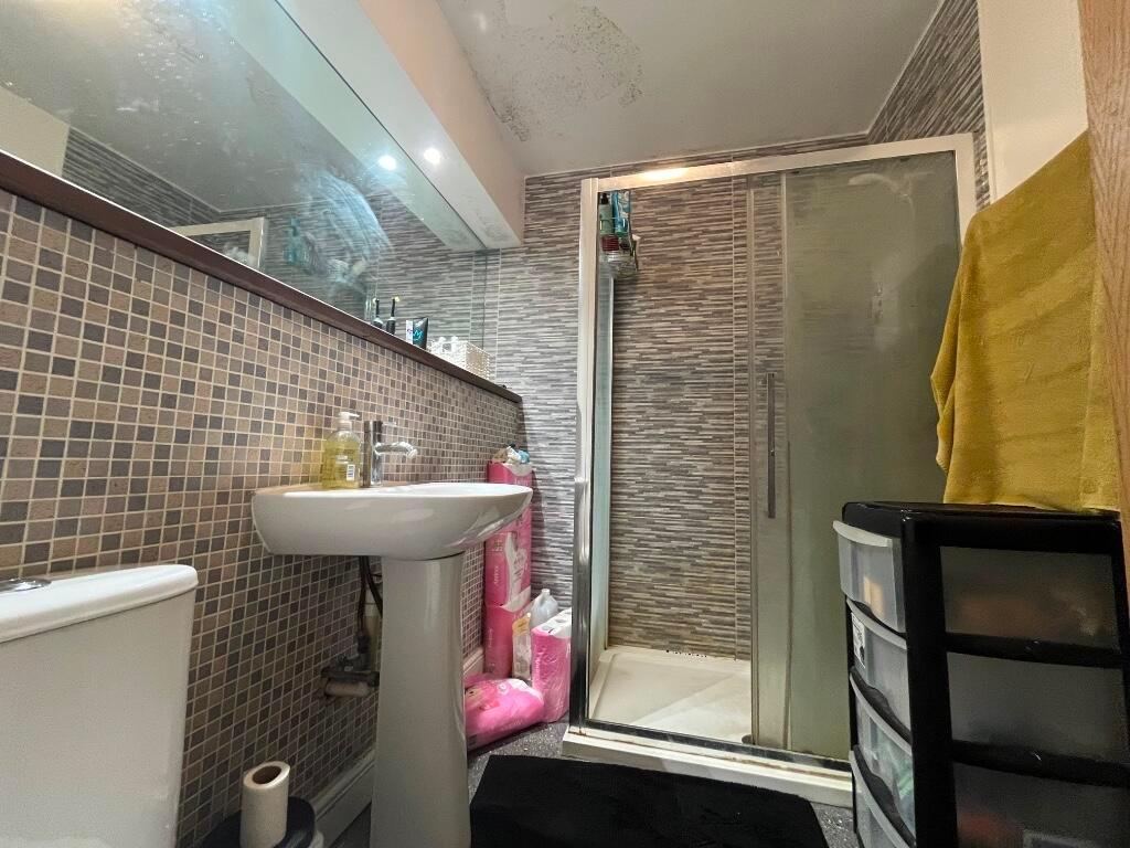 Bright and well-maintained bathroom featuring a...