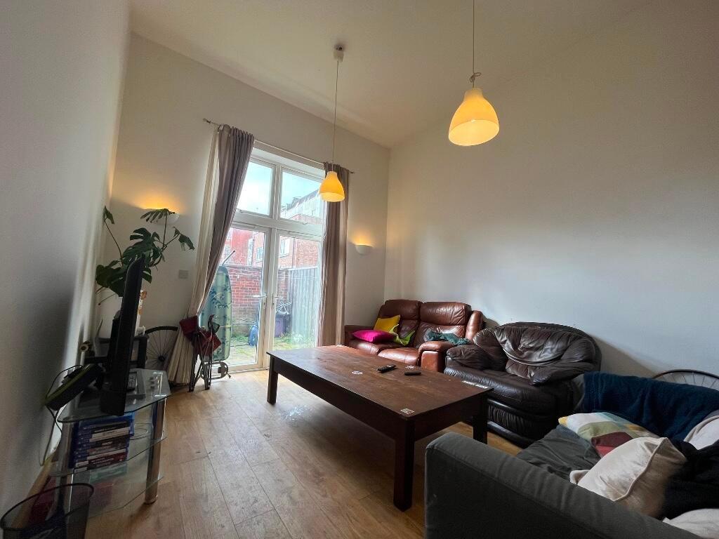 A cozy living room with comfortable leather sof...