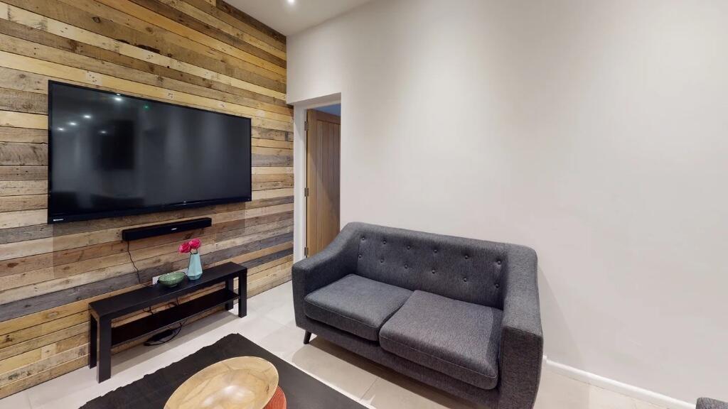 A modern living room featuring a comfortable da...