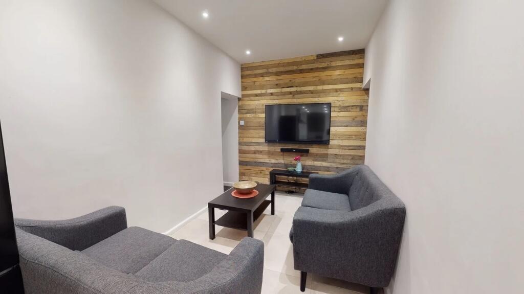A modern and cozy living room featuring two dar...