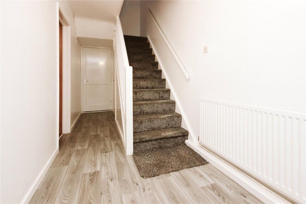 A clean and well-maintained hallway featuring m...