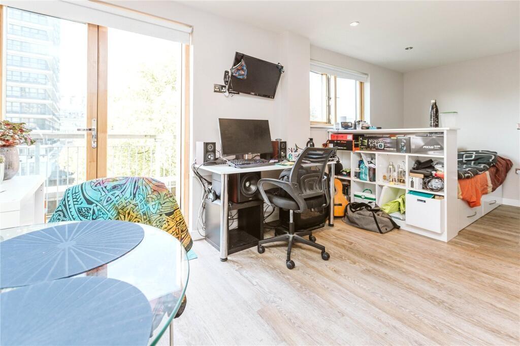 Bright and airy single bedroom featuring a mode...