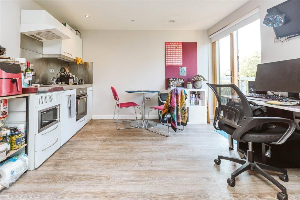 Bright and modern kitchen area featuring ample ...