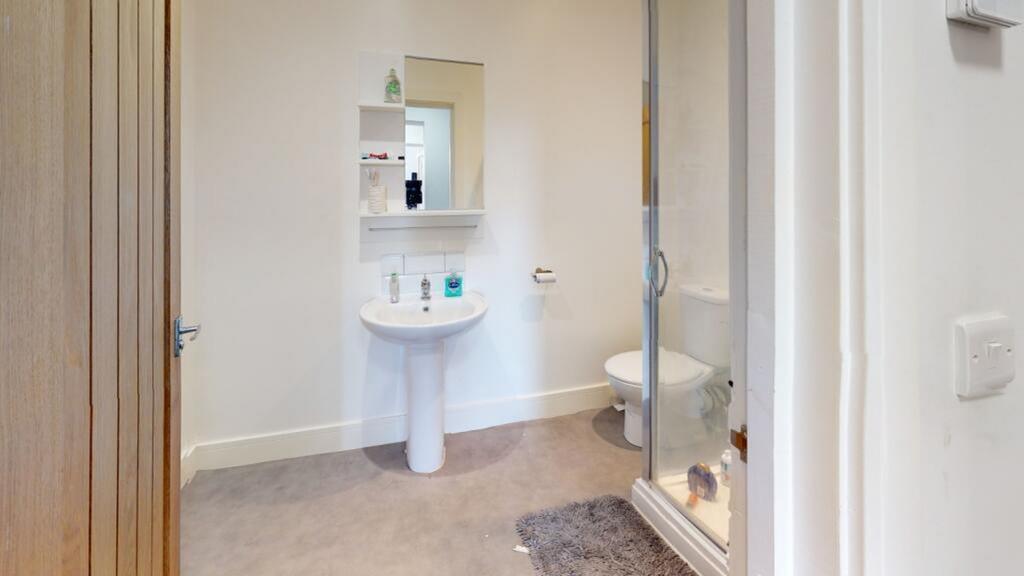 This modern bathroom features a sleek design wi...