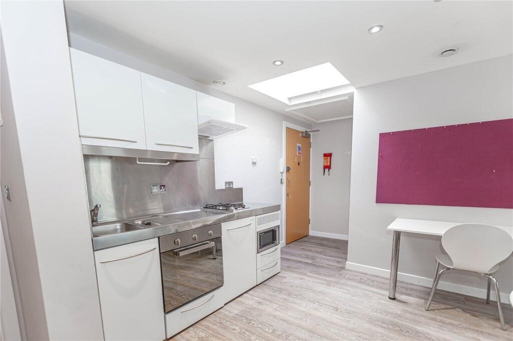 Bright and modern kitchen area featuring sleek ...