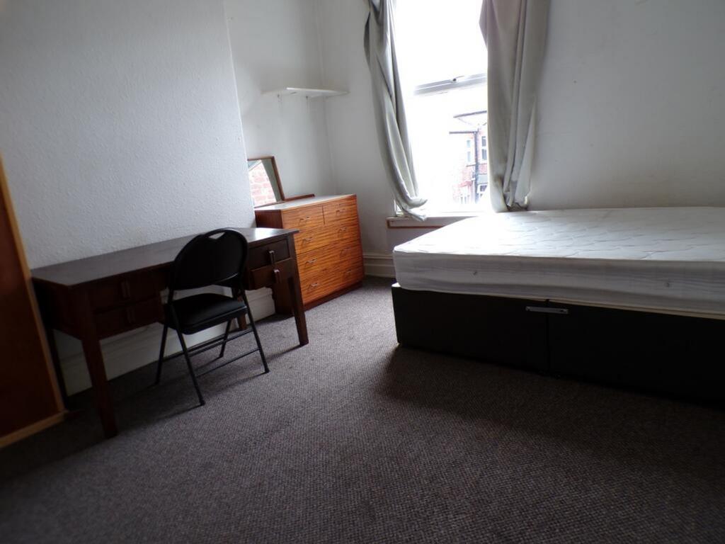 Bright and spacious double bedroom featuring a ...