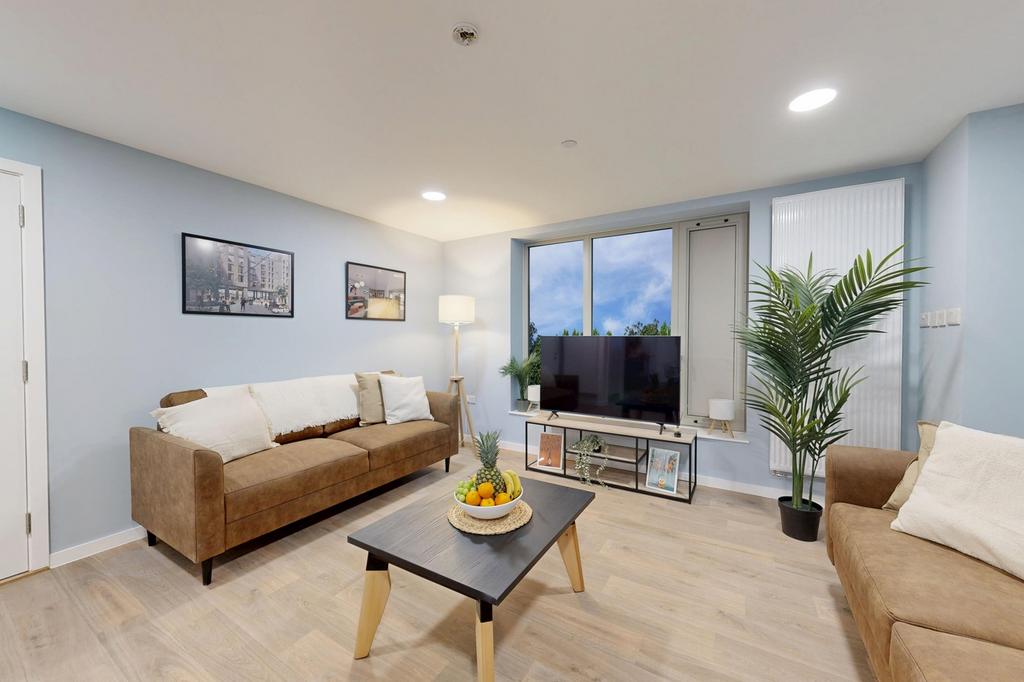 A spacious and stylish living room featuring co...