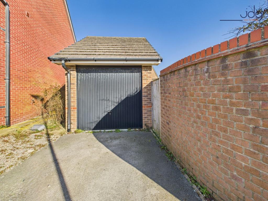 Garage located at the rear of the property