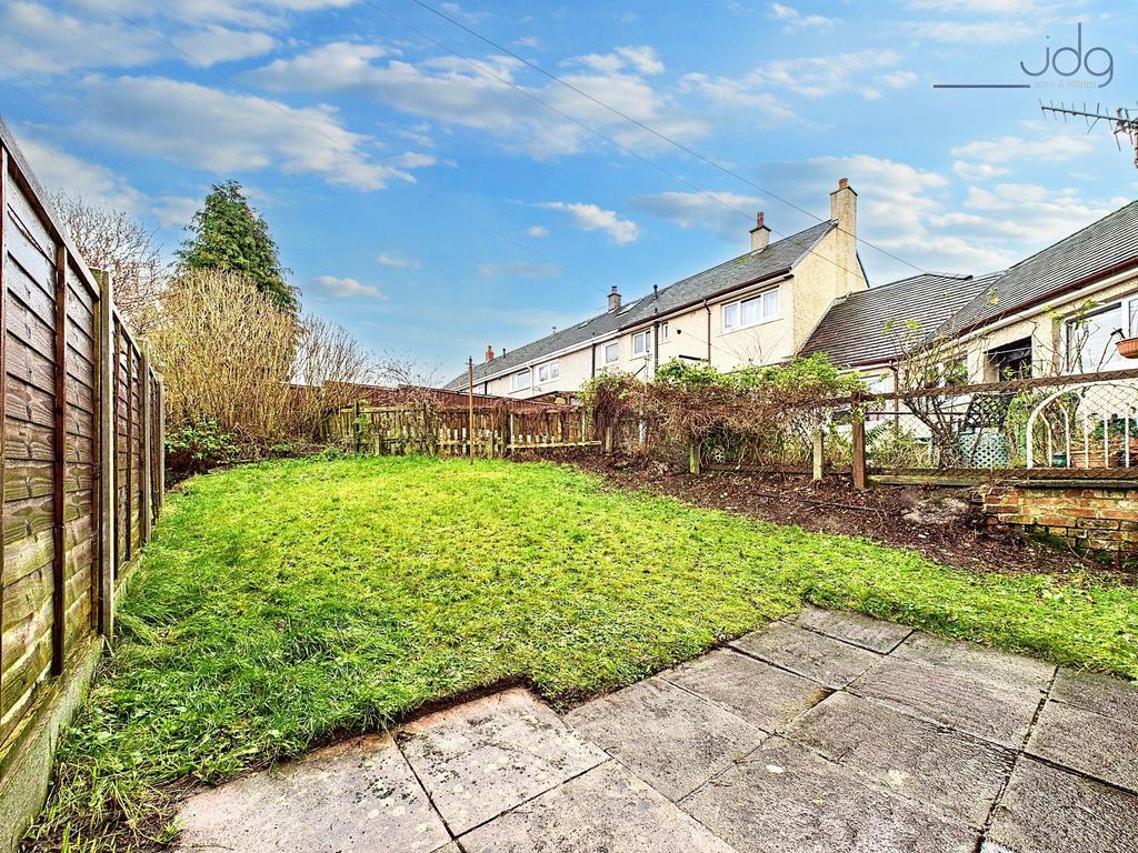 Spacious Garden with a mixture of flags and lawn