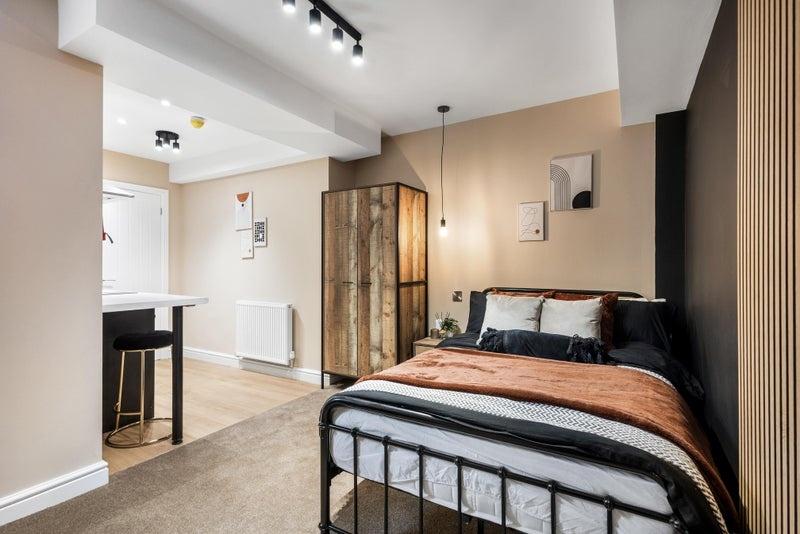 A stylish and cozy double bedroom featuring a c...