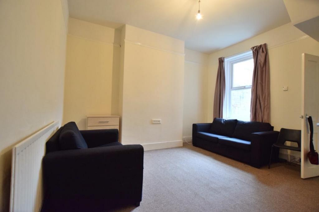A spacious and inviting living room, perfect fo...