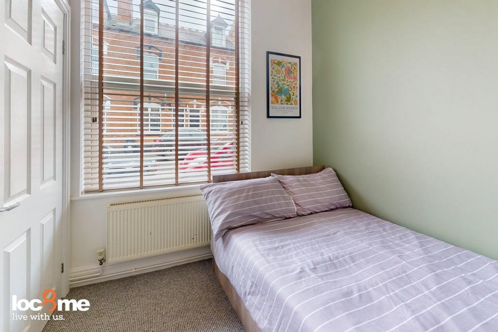 A bright and cozy double bedroom with ample nat...