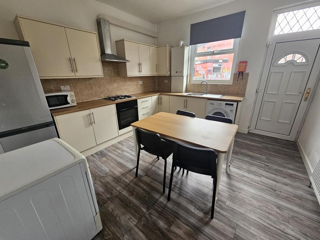 A bright and modern kitchen area featuring a wo...