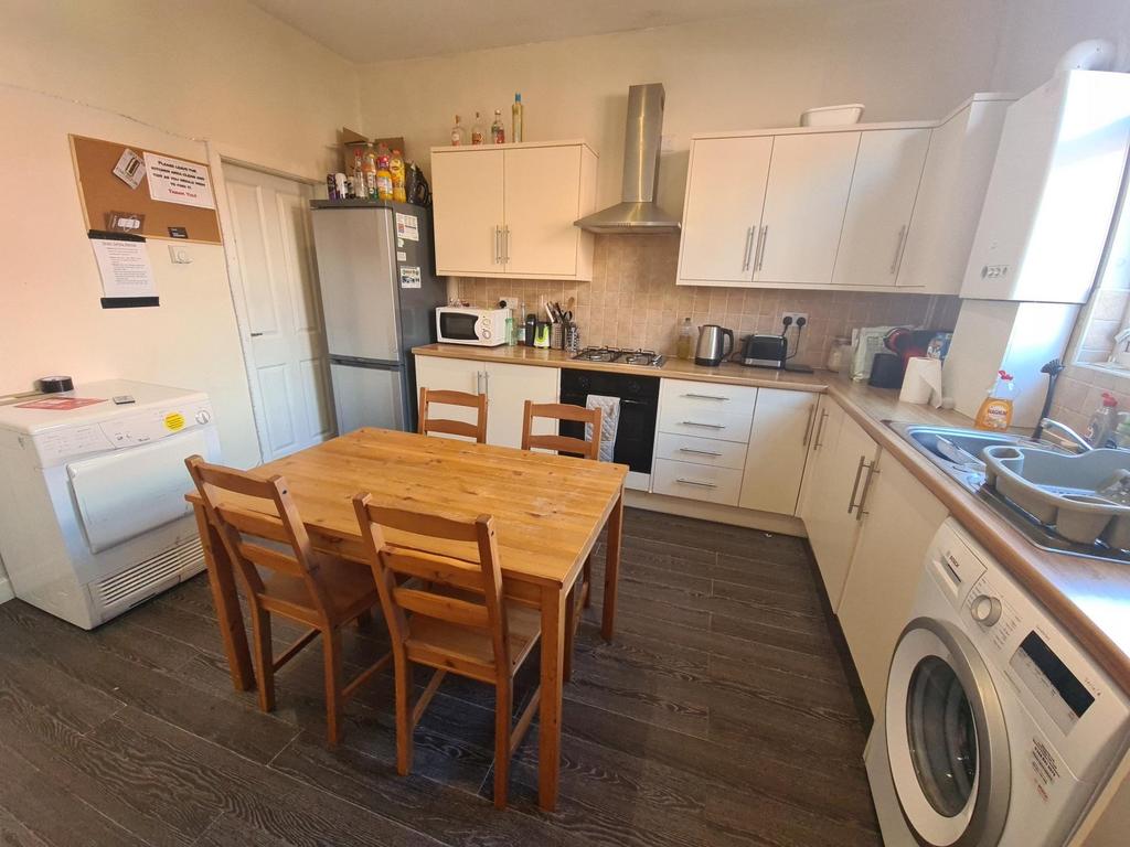 A bright and modern kitchen featuring ample cab...