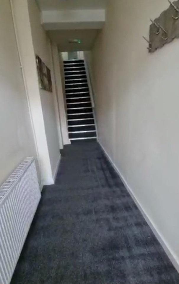 A clean and well-maintained hallway featuring n...