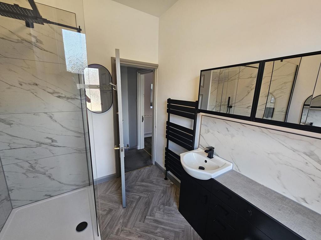 Modern and clean bathroom with a spacious sink ...