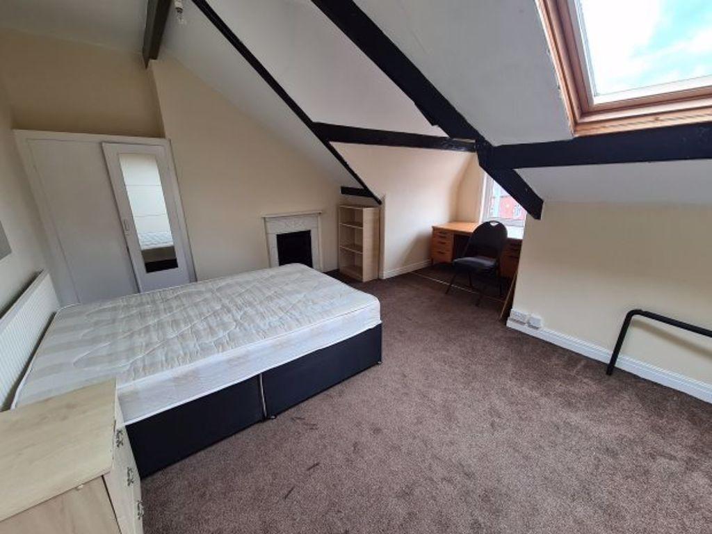 Bright and cozy double bedroom featuring a larg...