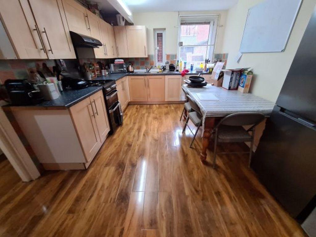 Bright and functional kitchen featuring ample w...