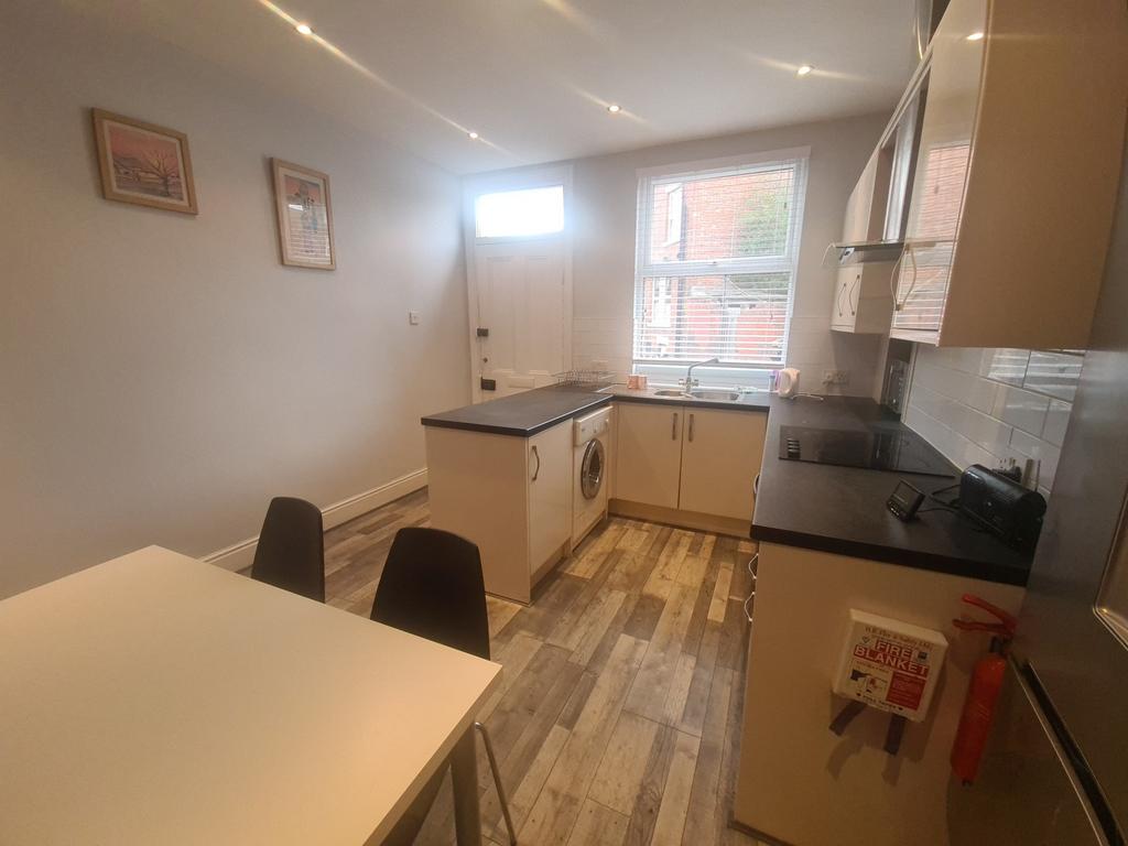 A bright and well-maintained kitchen with ample...