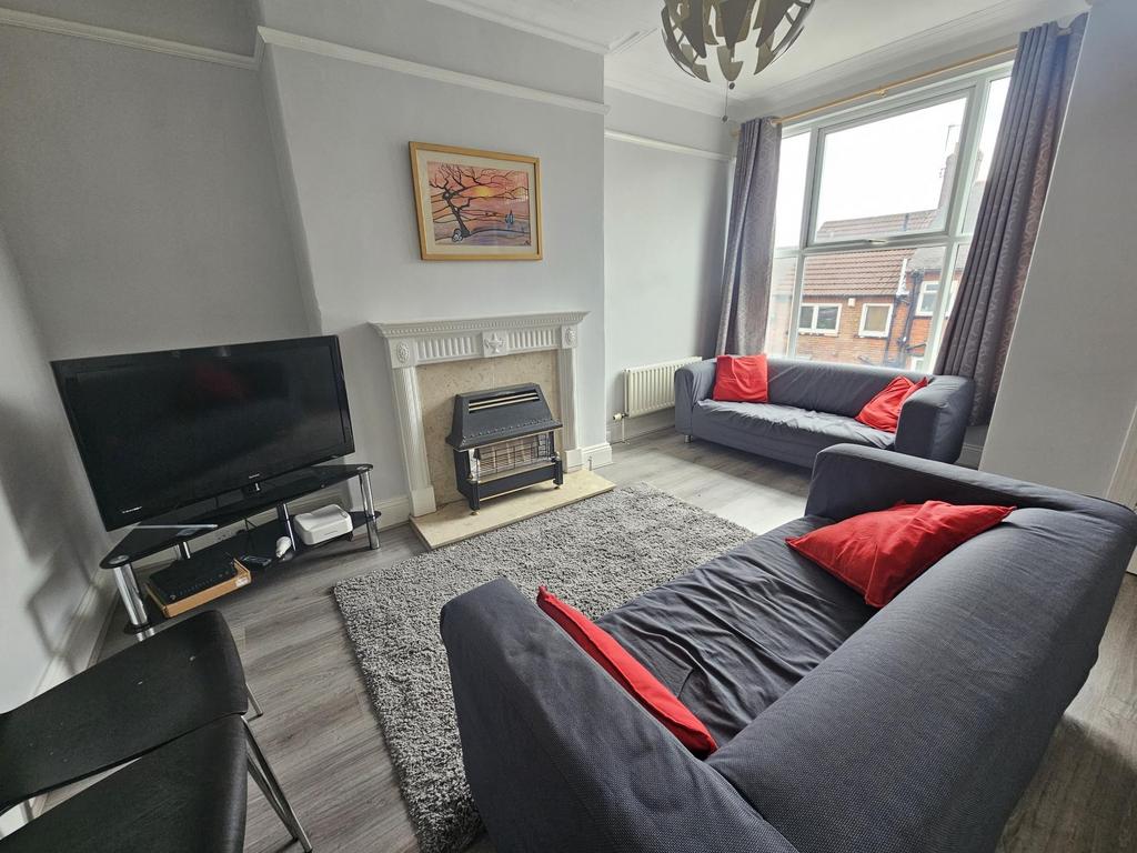 A bright, contemporary living room featuring a ...