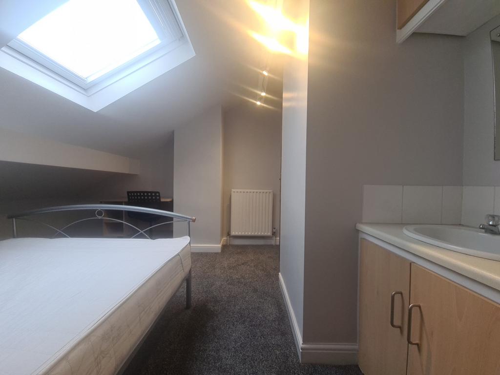 A clean and well-maintained bathroom with ample...
