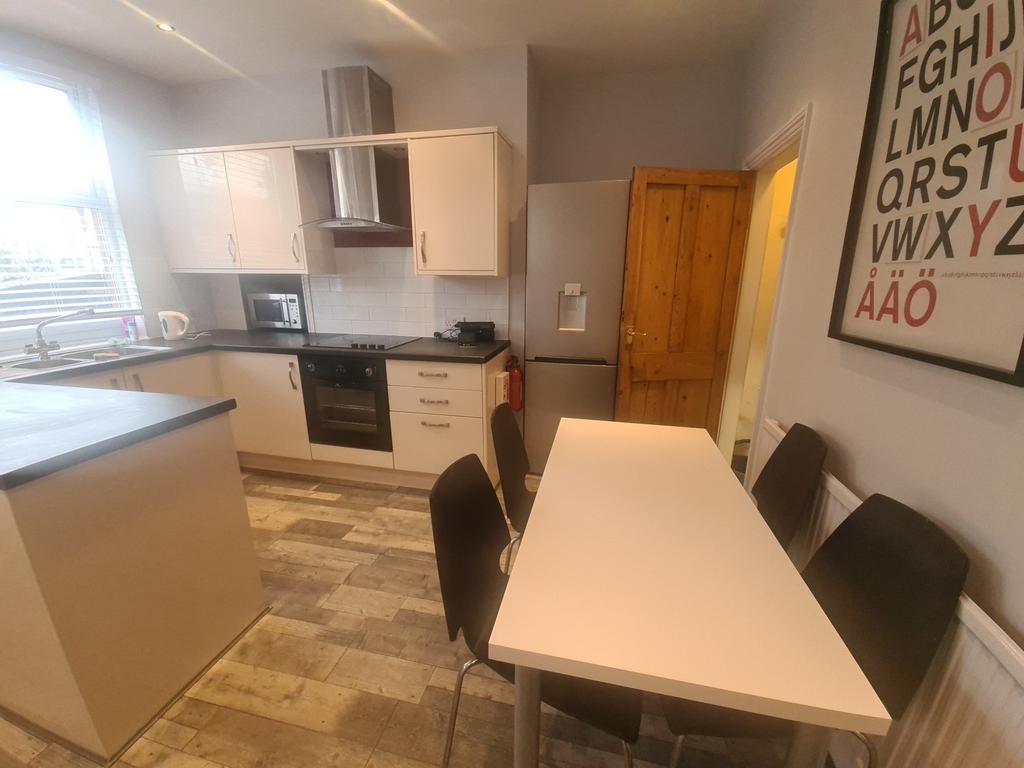 Modern kitchen with neutral cabinets, integrate...