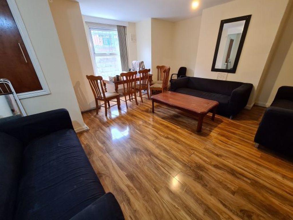 A spacious and modern living room filled with n...