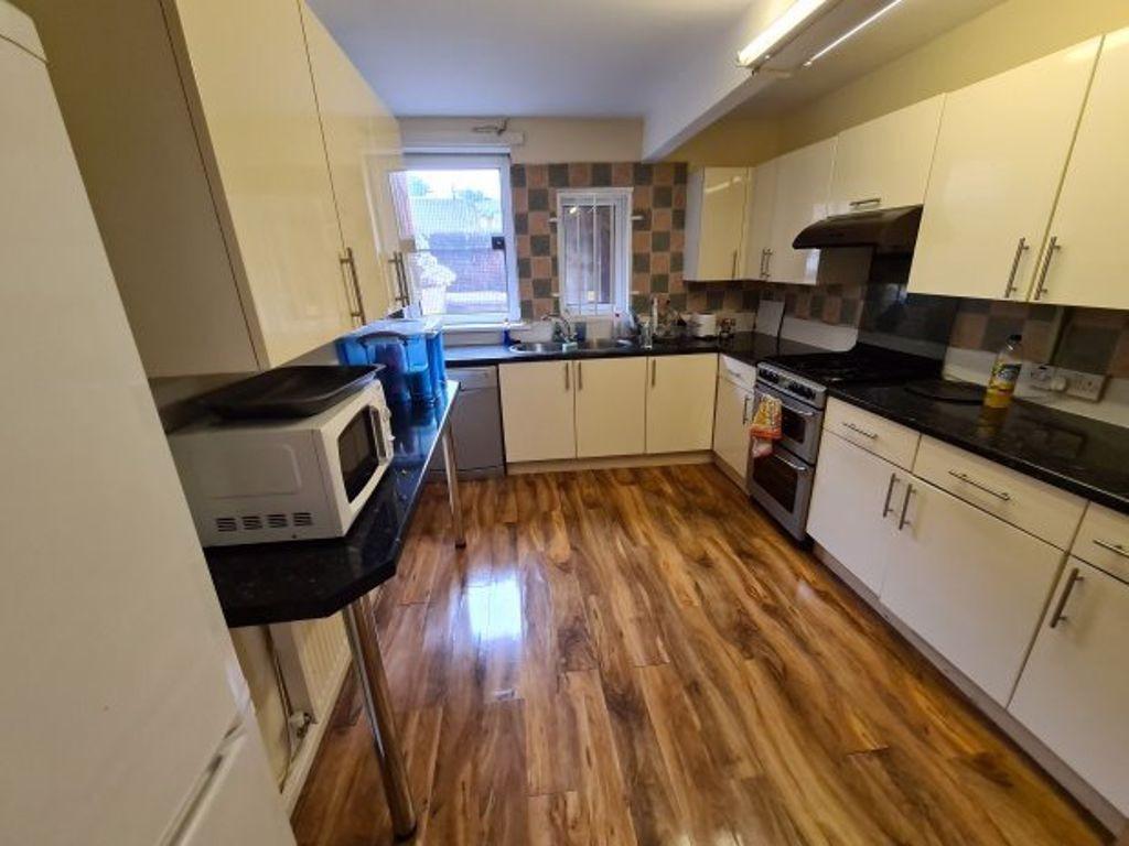 A bright and clean kitchen area featuring moder...