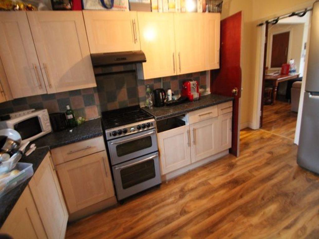 Bright and tidy kitchen with functional applian...