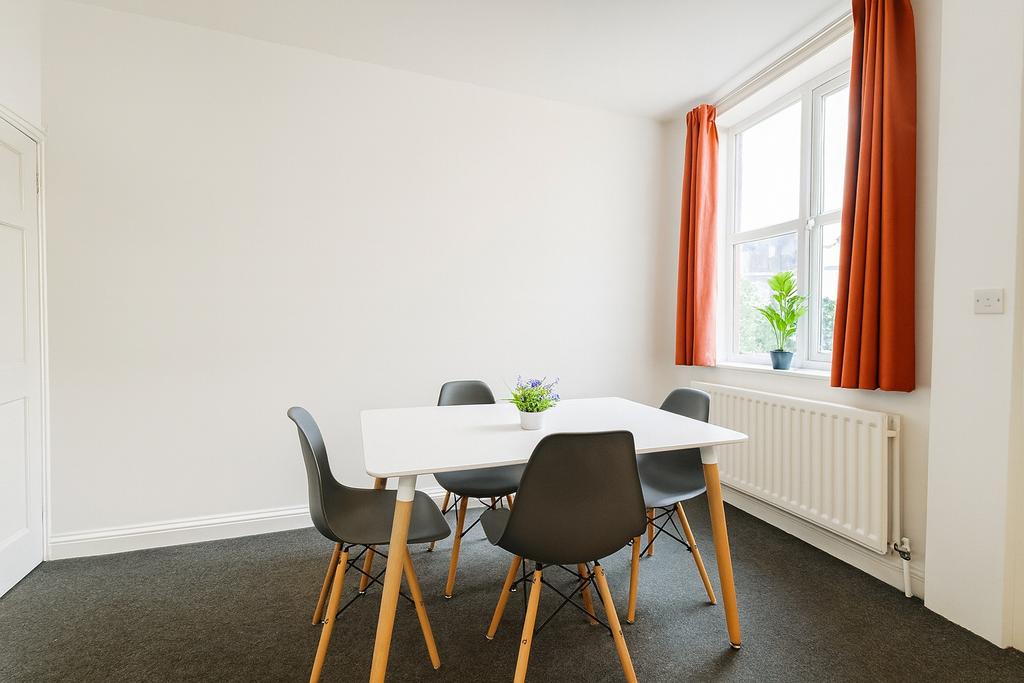 Bright, minimal communal workspace with a moder...