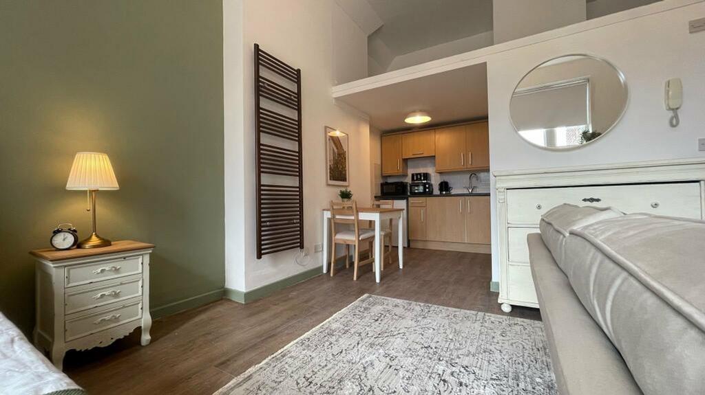 A stylish and inviting living room with ample n...