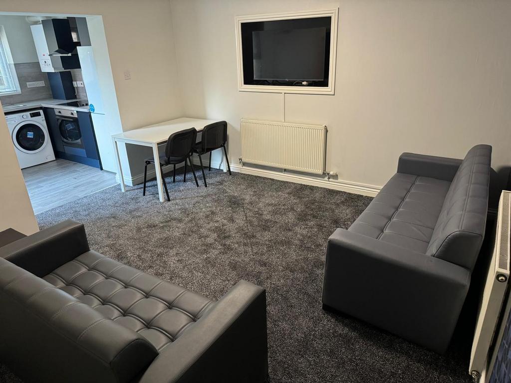 A stylish and inviting living room featuring co...