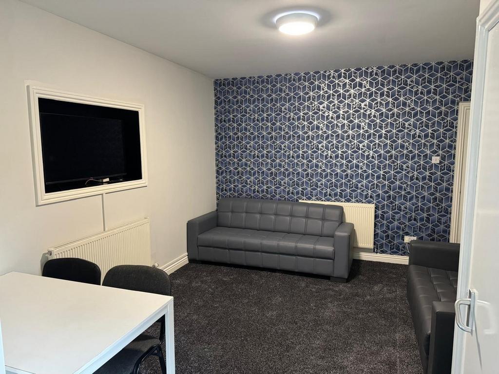 A modern and inviting living room featuring sty...