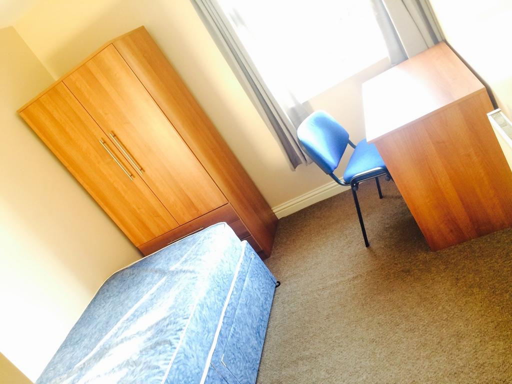 This inviting double bedroom features a comfort...