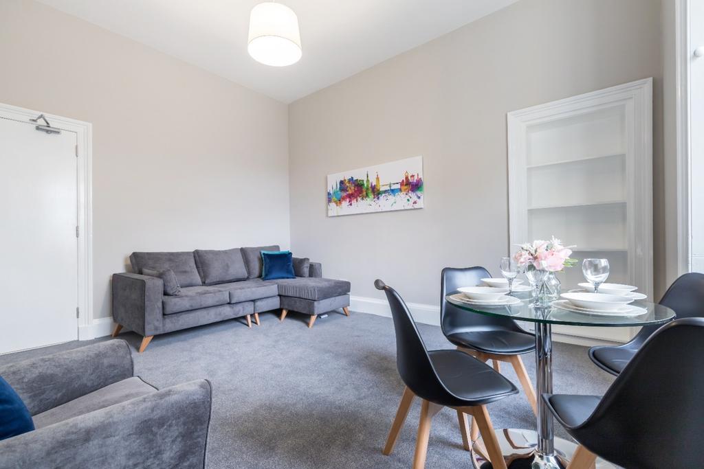 A bright and inviting living room featuring a m...