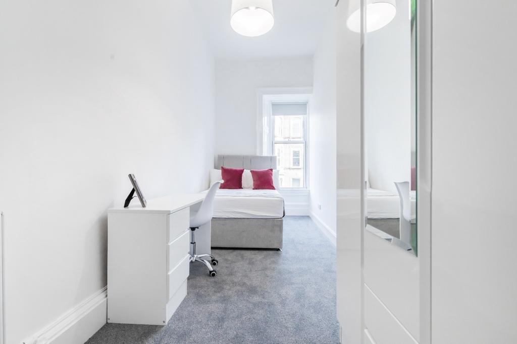 Bright and inviting double bedroom featuring a ...