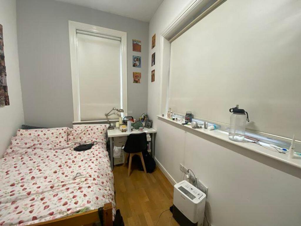 A cozy double bedroom with natural light, perfe...