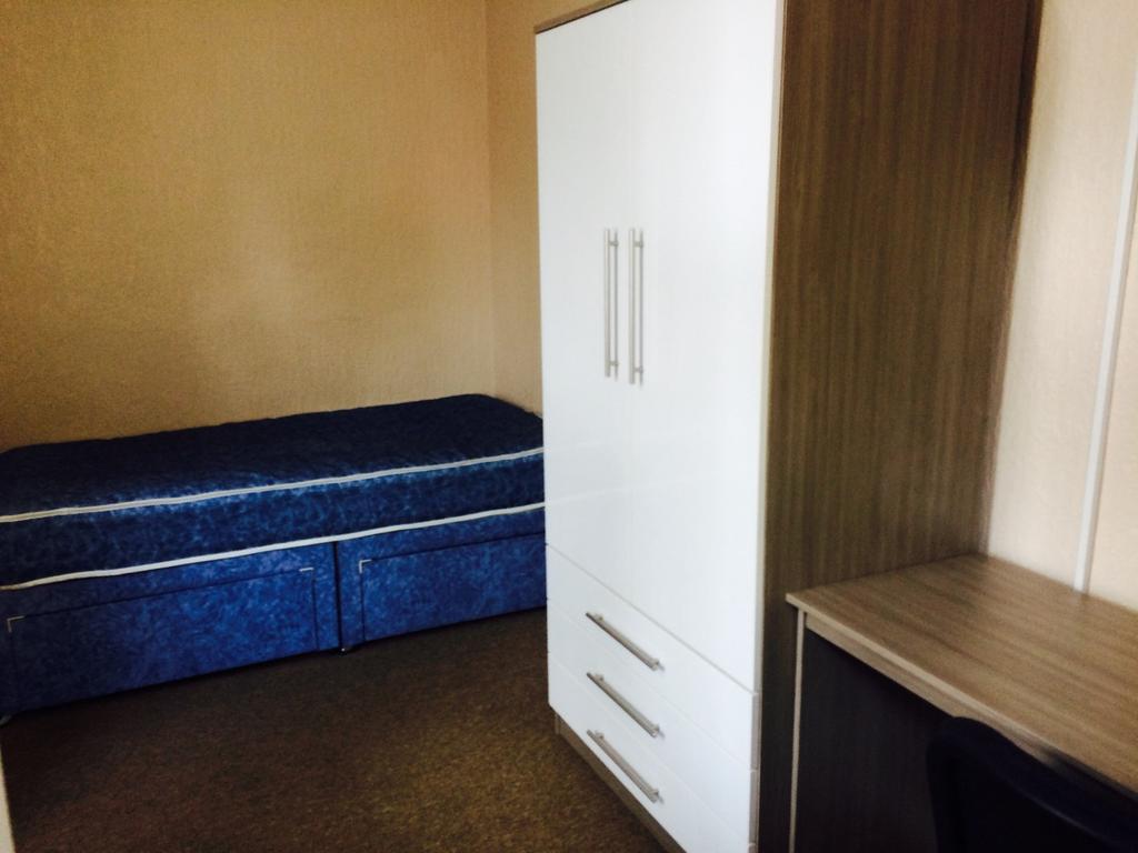 Cozy double bedroom featuring a comfortable bed...