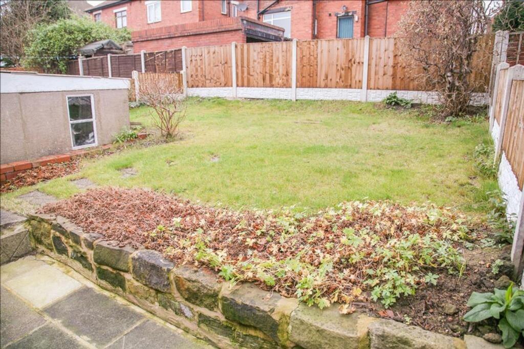 A charming garden space featuring a well-mainta...
