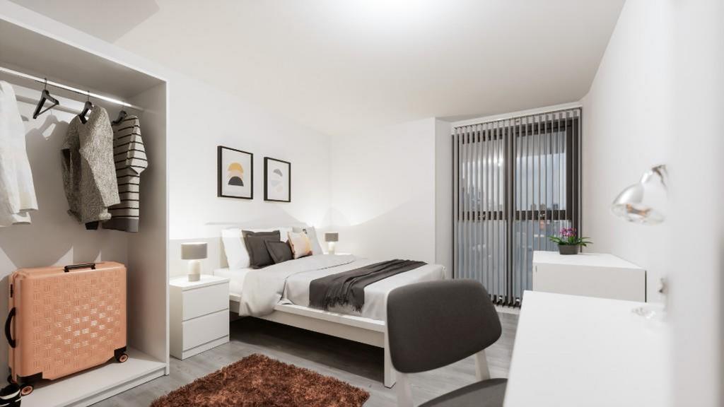 This spacious double bedroom features ample nat...