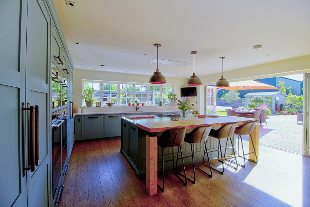 Bifold doors open to sunny south-facing terrace