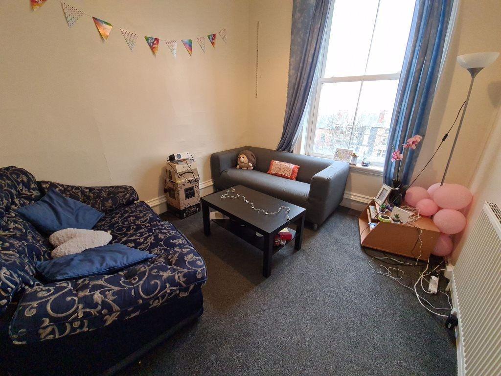 Cozy living room featuring comfortable sofas an...